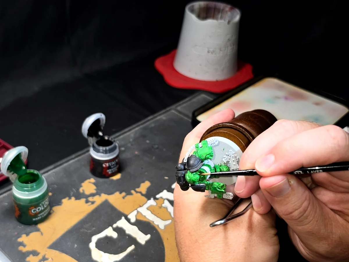Close-up of miniature painting in progress at Forge Without Limits.