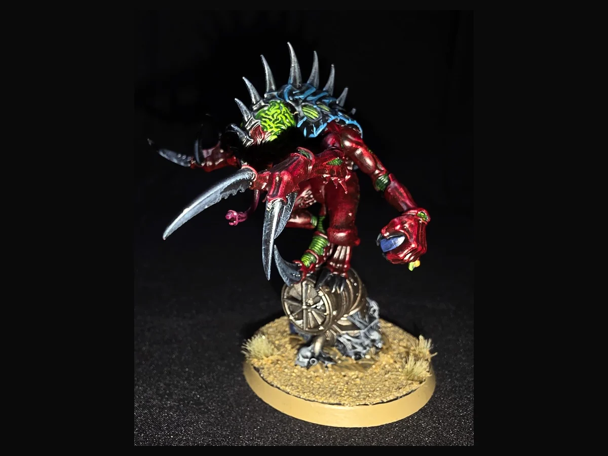 Painted red Tyranid character miniature.