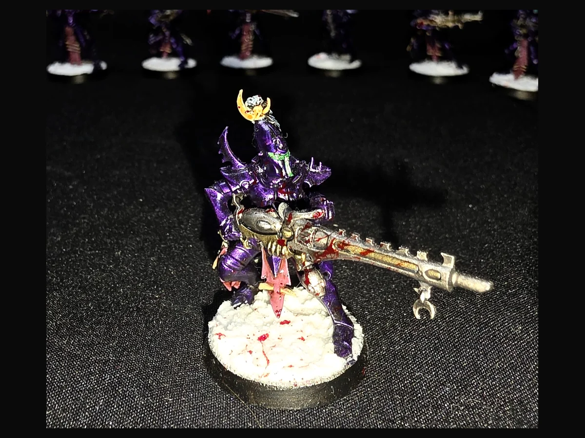 Painted Drukhari miniature displayed against a dark background.